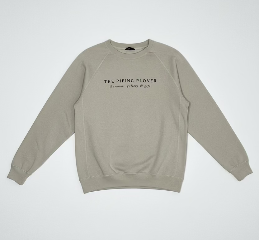 Beige sweatshirt with text on a white background