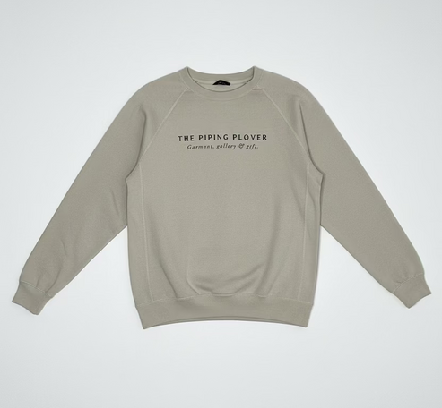 Beige sweatshirt with text on a white background