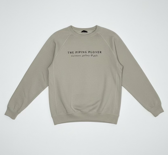 Beige sweatshirt with text on a white background
