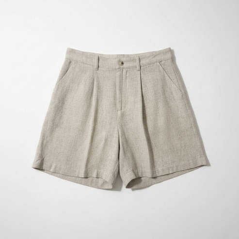 Pair of beige shorts on a white background