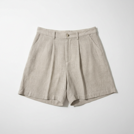 Pair of beige shorts on a white background