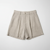 Pair of beige shorts on a white background