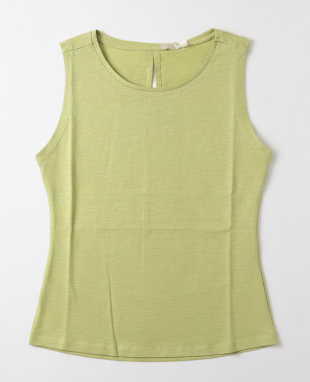 Green tank top on a black hanger against a white wall