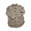 Beige corduroy shirt on a blue sky background