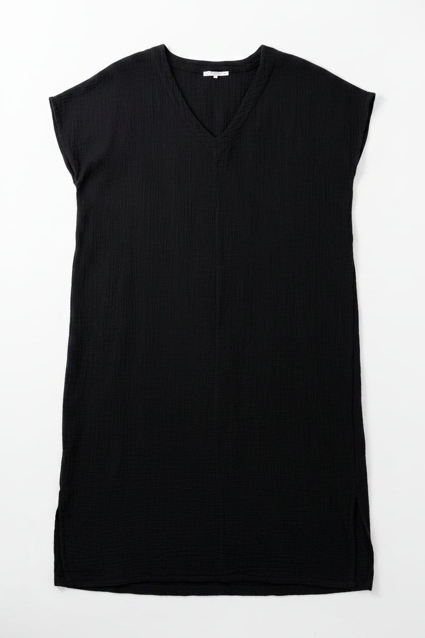 Black sleeveless dress on a hanger with a white background