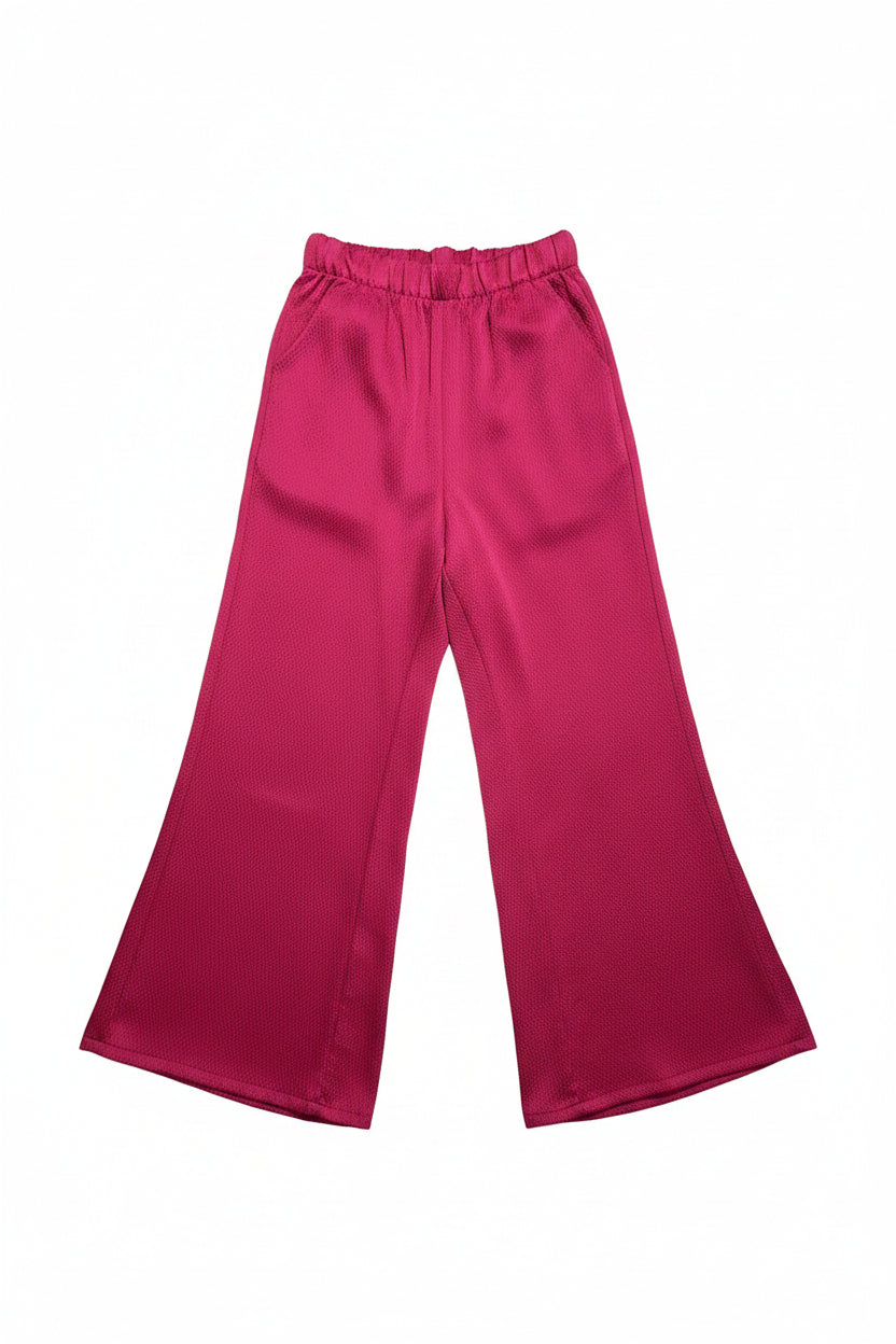 Pink pants on a white surface