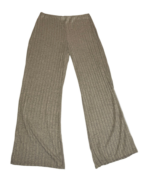 Pair of beige ribbed pants on a white surface